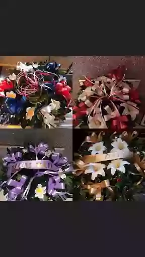 Holly wreaths by flowers & butterflys